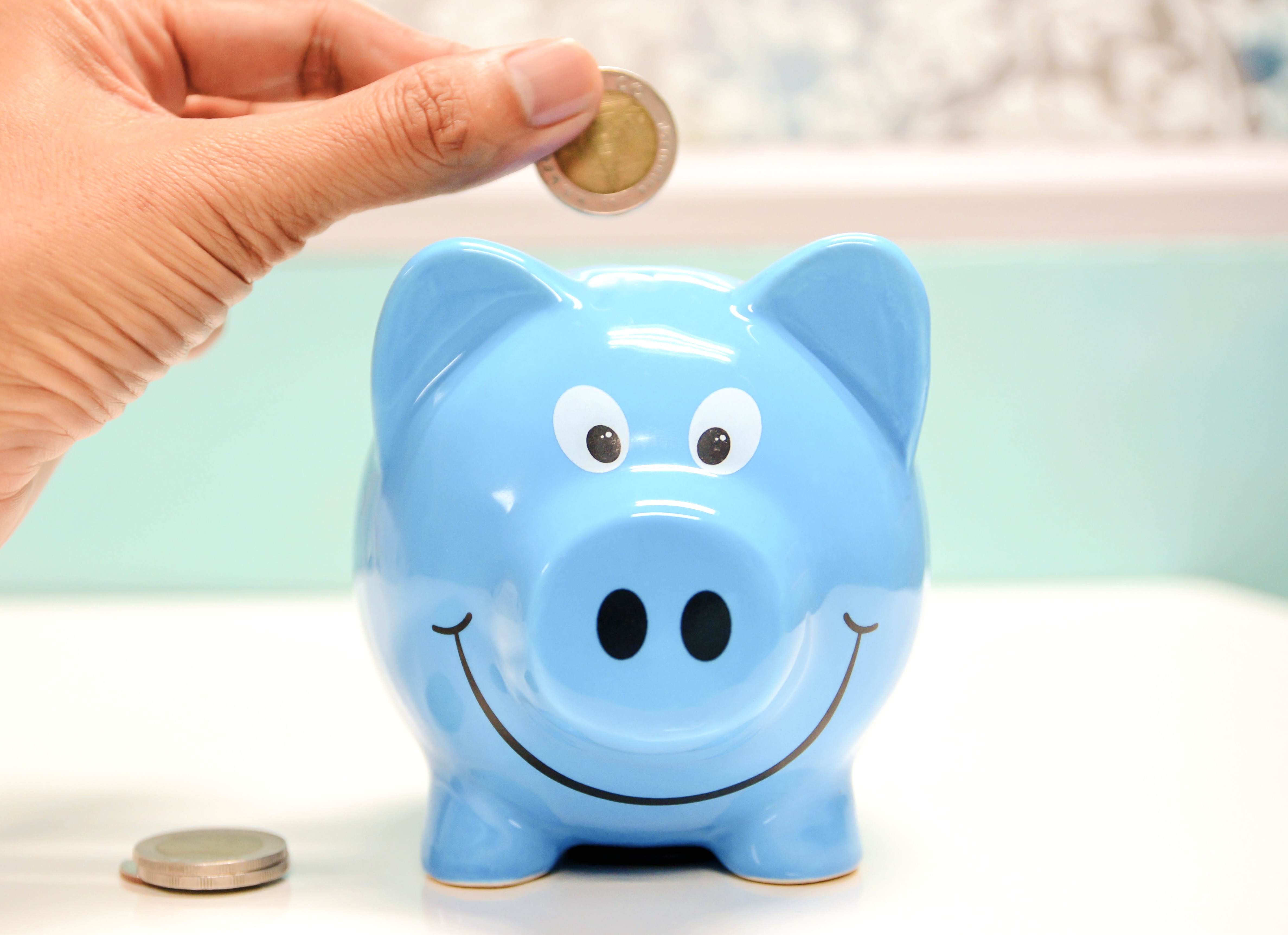 Piggy bank representing trademark fees and savings with a trademark attorney.